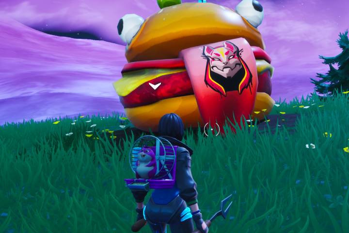 Fortnite : Visiter la tête Durrr Burger portant la marque du Nomade, un dinosaure et une tête de pierre, défi Road Trip, saison 10